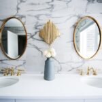 What factors contribute to the high cost of bathroom remodeling?