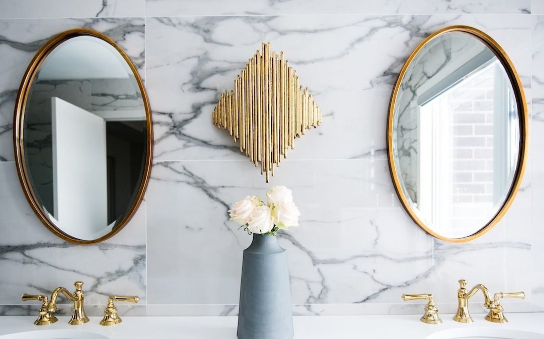 What factors contribute to the high cost of bathroom remodeling?
