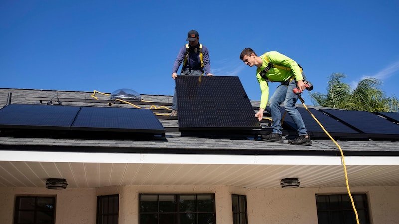 What home improvement brings the most value when it comes time to sell? 5 men on top of a roof