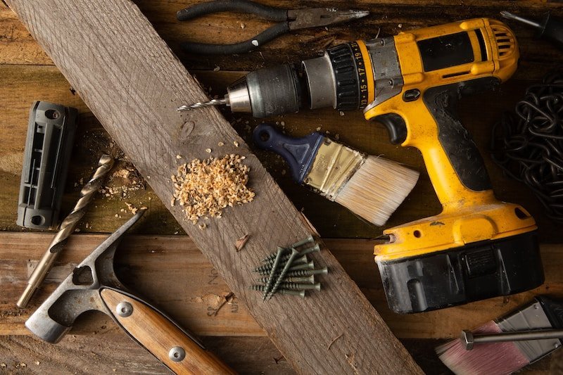 How much does a bathroom remodel increase home value 2 a couple of tools that are sitting on a table